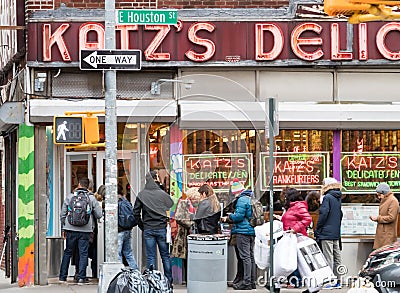 A crowd of people wait in line outside the famous Katzâ€™s Deli in the Lower East Side of New York City on Houston Street Editorial Stock Photo